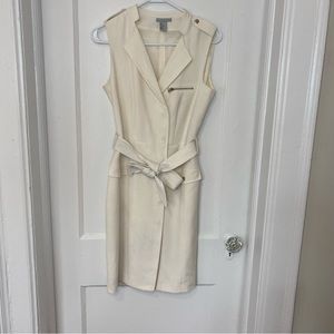 Cream work dress with stylish details.